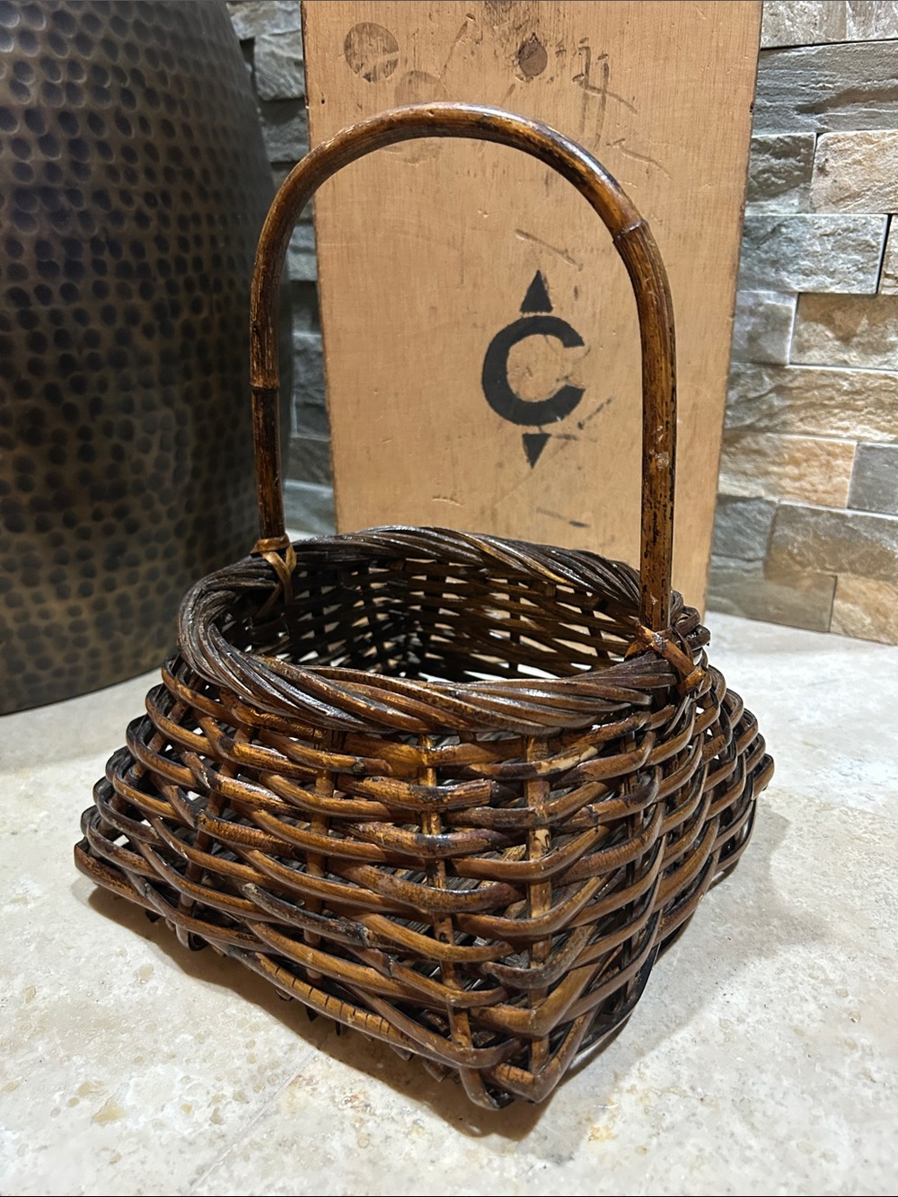 vintage handwoven wicker basket features a square base